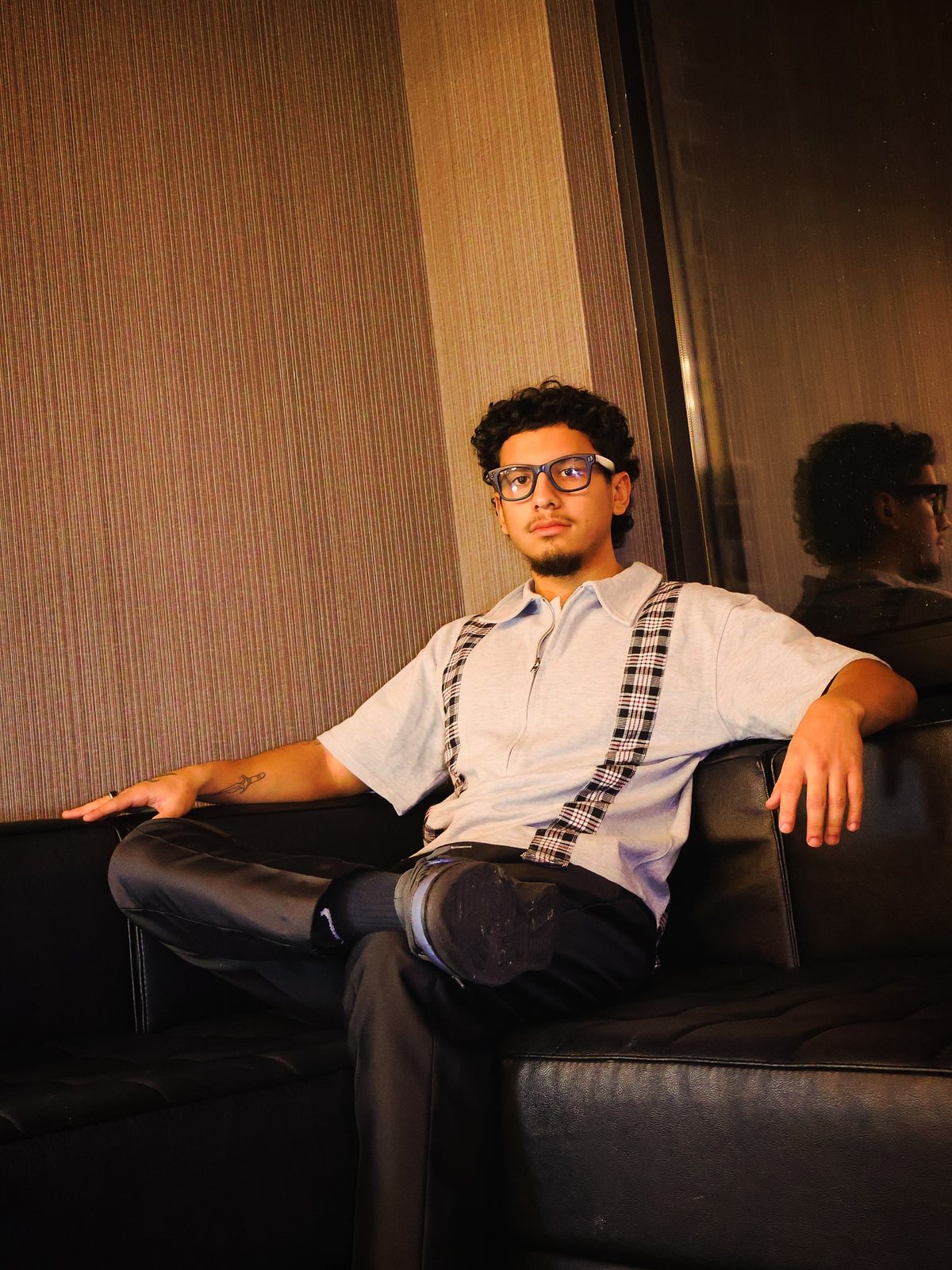 Dnd sitting on a leather couch